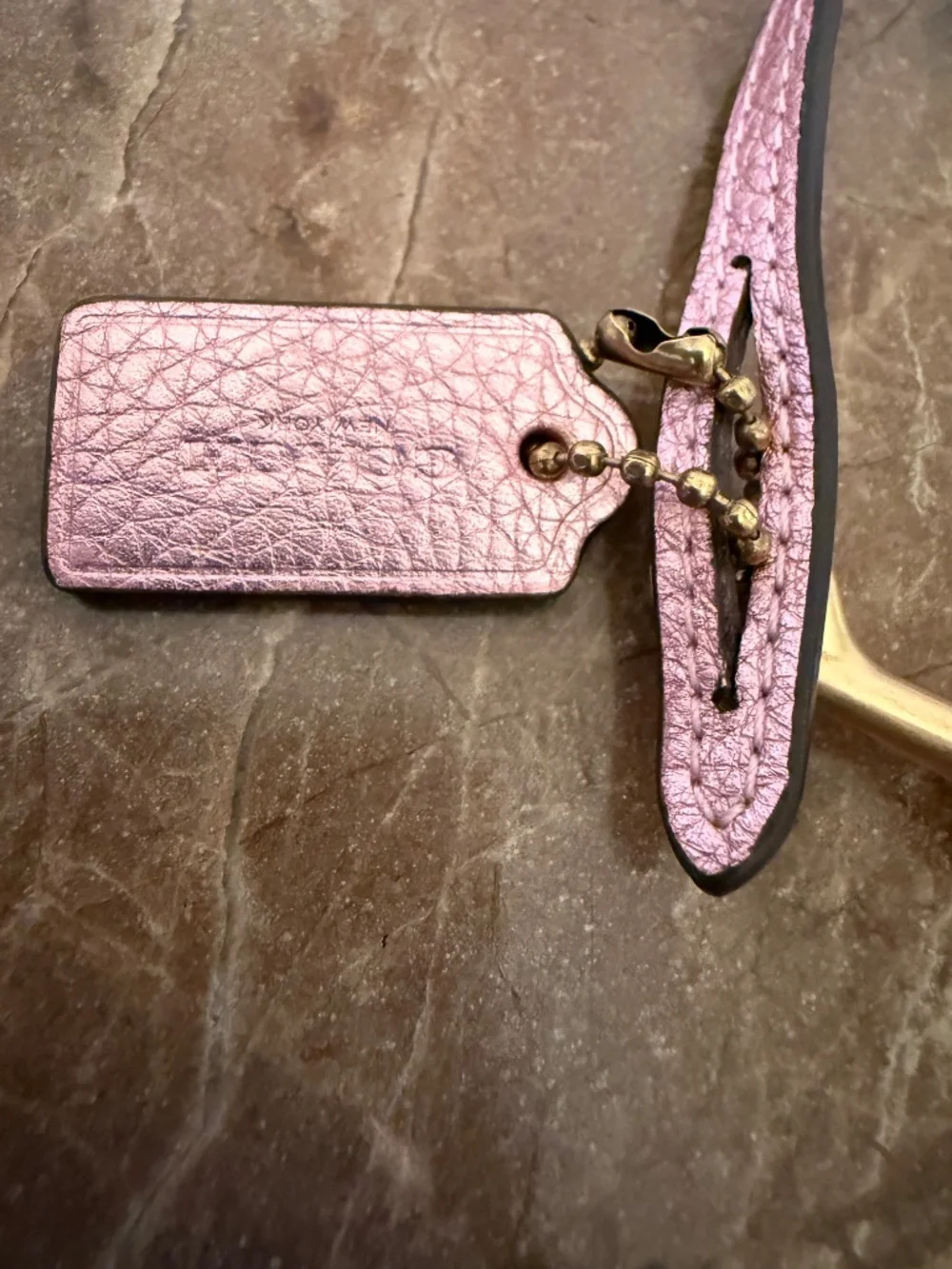 Coach Pebbled Leather Wrist Strap Loop Bag Charm with Hangtag Metallic Pink
